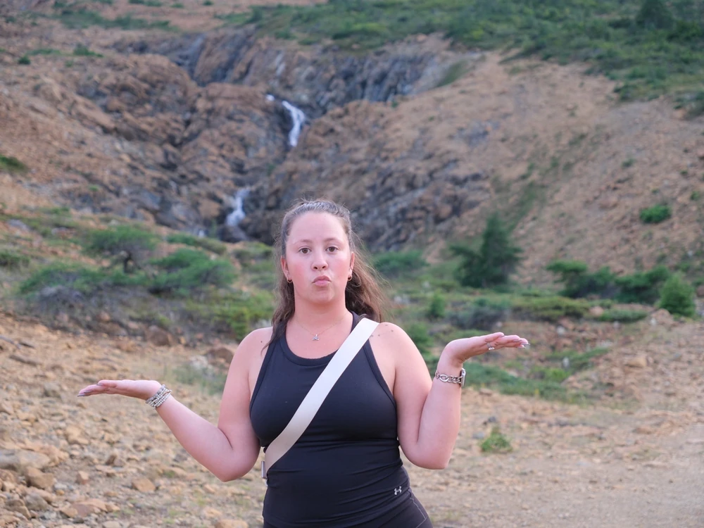 Amber posing with her hands out at the Tablelands